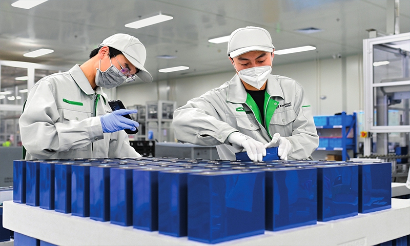 Staff members operate on a 10.5 GWh power battery production line at a local industry park in Ordos, North China's Inner Mongolia Autonomous Region on January 15, 2023. Photo:VCG