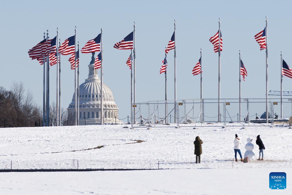 People visit the snow-covered National Mall in Washington, D.C., the United States, Jan. 17, 2024.(Photo: Xinhua)