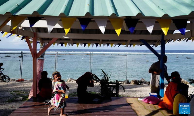 People enjoy their leisure time at a beach in the Republic of Nauru, Jan. 20, 2024. (Xinhua/Wang Shen)