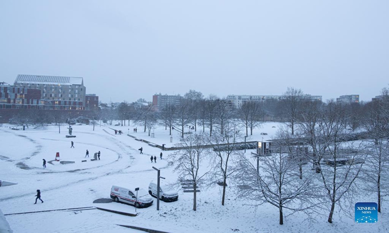 This photo taken on Jan. 17, 2024 shows a city view amid snowfall in Lille, northern France. (Photo by Sebastien Courdji/Xinhua)