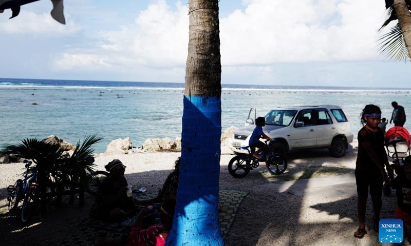 People enjoy their leisure time at a beach in the Republic of Nauru, Jan. 20, 2024. (Xinhua/Wang Shen)