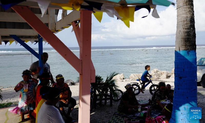 People enjoy their leisure time at a beach in the Republic of Nauru, Jan. 20, 2024. (Xinhua/Wang Shen)