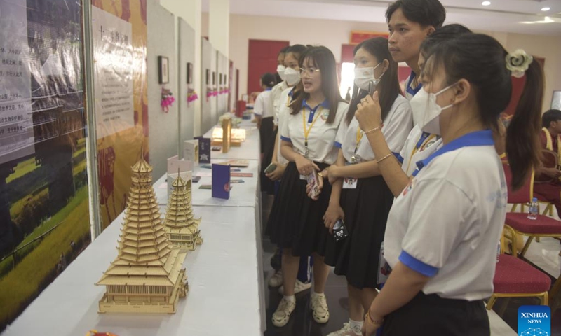 Students visit a Chinese and Cambodian cultural exhibition in Phnom Penh, Cambodia, Jan. 21, 2024. A China-Cambodia Beauty of Intangible Heritage exhibition kicked off here in the Cambodian capital on Sunday, captivating hundreds of visitors. (Photo by Liao Hongqing/Xinhua)