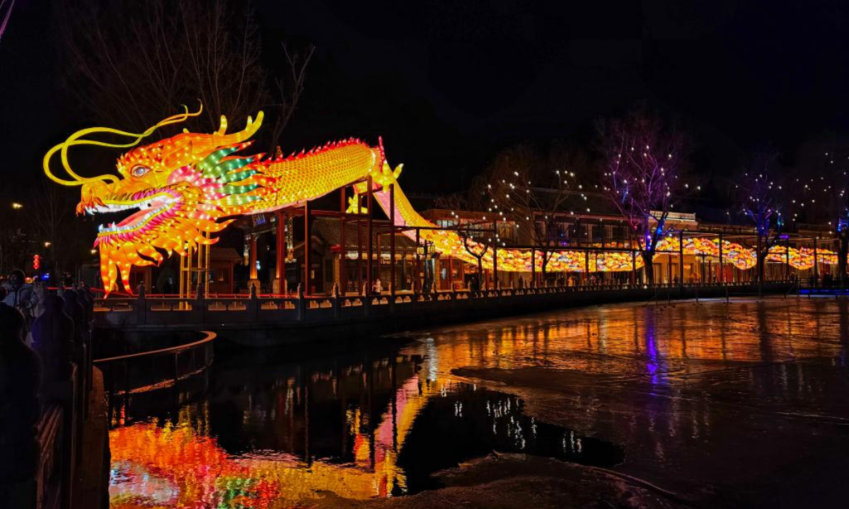 A dragon-shaped light installation is seen on Lunar New Year Eve in Shichahai area, Beijing, capital of China, Feb 9, 2024. Photo:Xinhua