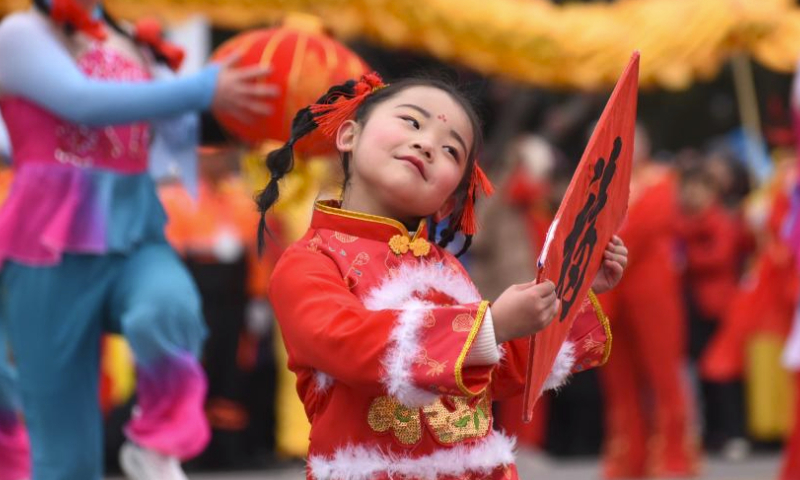 A girl dances during a Lantern Festival celebration at Yiyuan County in Zibo City, east China's Shandong Province, Feb. 24, 2024. People across the country celebrated the Lantern Festival on Saturday amid a festive and bustling atmosphere. (Photo by Zhao Dongshan/Xinhua)