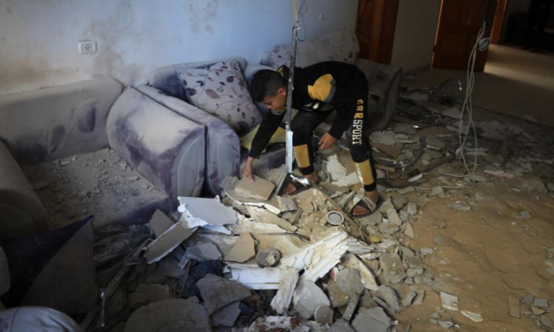 A Palestinian checks a room of a damaged building after an Israeli airstrike in the southern Gaza Strip city of Rafah, on March 2, 2024.

The Palestinian death toll in the Gaza Strip has risen to 30,320, the Hamas-run Health Ministry said in a press statement on Saturday. (Photo by Yasser Qudih/Xinhua)