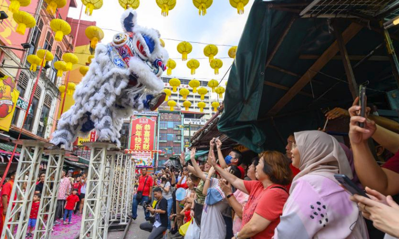 Members of a lion dance troupe perform during the Lantern Festival celebration at Petaling Street of Kuala Lumpur, Malaysia, Feb. 24, 2024. (Photo by Chong Voon Chung/Xinhua)