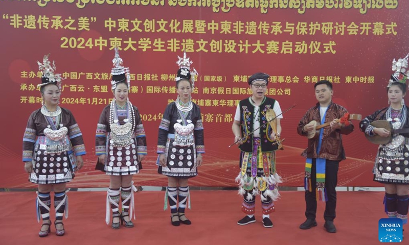 Chinese inheritors of intangible cultural heritage perform Grand Song of the Dong ethnic group in Phnom Penh, Cambodia, Jan. 21, 2024. A China-Cambodia Beauty of Intangible Heritage exhibition kicked off here in the Cambodian capital on Sunday, captivating hundreds of visitors. (Photo by Liao Hongqing/Xinhua)