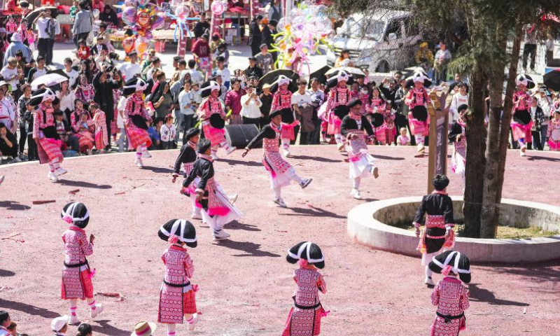 People of Miao ethnic group perform a dance to celebrate Tiaohua festival in Gaoxing Village of Liuzhi Special District, Liupanshui, southwest China's Guizhou Province, Feb. 19, 2024. People of Miao ethnic group celebrated the Tiaohua festival here on Monday to pray for the harvest and well-being in the new year. (Xinhua/Tao Liang)