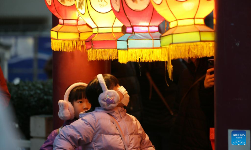 Children view lanterns in the Chinatown of Yokohama, Japan, Feb. 11, 2024. Tourists came to the Chinatown to enjoy festive atmosphere of the Spring Festival. (Xinhua/Yue Chenxing)