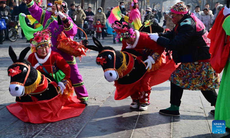 Villagers perform Yangge, a traditional folk dance, in Liaocheng, east China's Shandong Province, Feb. 11, 2024. China on Saturday ringed in the Chinese Lunar New Year, or Spring Festival. Regarded as the most celebrated holiday among Chinese, it signifies a time of joyful family reunions and a slew of cultural events. (Photo by Zhang Zhenxiang/Xinhua)