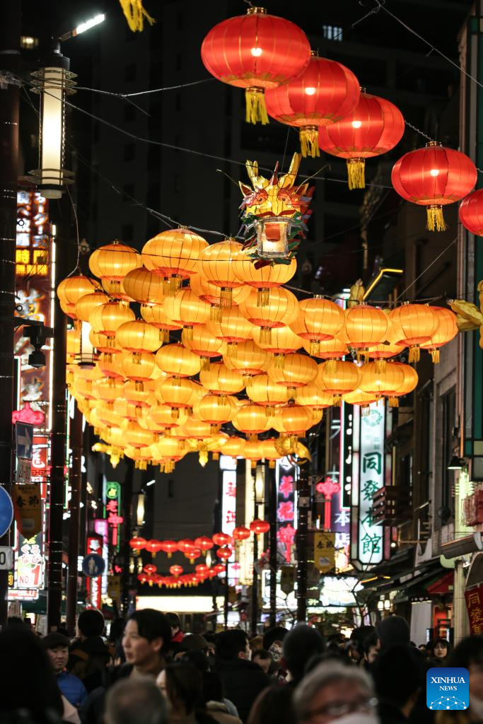 Tourists visit the Chinatown of Yokohama, Japan, Feb. 11, 2024. Tourists came to the Chinatown to enjoy festive atmosphere of the Spring Festival. (Xinhua/Yue Chenxing)