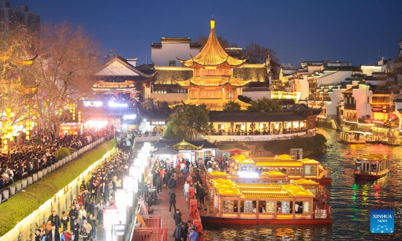 Tourists visit the Fuzi (Confucius) Temple scenic area in Nanjing, east China's Jiangsu Province, Feb. 14, 2024. More Chinese people nowadays choose to go on a journey during the Spring Festival to experience different cultures and lunar new year atmosphere. (Photo by Su Yang/Xinhua)