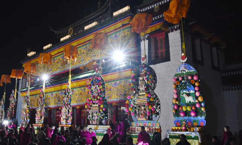 Butter sculptures made by Buddhists are displayed at Labrang Monastery in Xiahe County, northwest China's Gansu Province, Feb. 24, 2024. An annual butter sculpture show was held at Labrang Monastery, one of six prestigious temples of the Gelug Sect of Tibetan Buddhism, on Saturday, the Chinese Lantern Festival, to pray for good fortune and harvest. (Xinhua/Chen Bin)