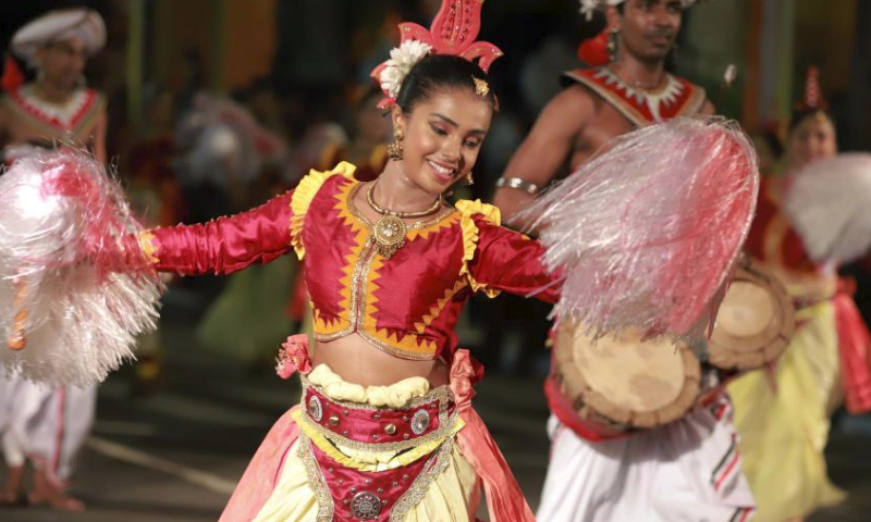 People perform traditional dances during the annual Navam Perahera festival in Colombo, Sri Lanka, on Feb. 23, 2024. (Photo by Ajith Perera/Xinhua)