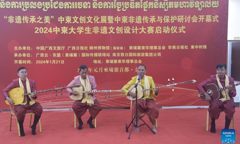 Cambodian inheritors of intangible cultural heritage perform Chapei Dang Veng in Phnom Penh, Cambodia, Jan. 21, 2024. A China-Cambodia Beauty of Intangible Heritage exhibition kicked off here in the Cambodian capital on Sunday, captivating hundreds of visitors. (Photo by Liao Hongqing/Xinhua)