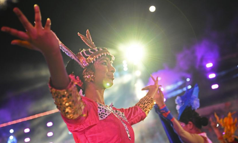 Performers dance during the Chingay Parade as part of the Lunar New Year celebrations in Singapore's F1 Pit Building on Feb. 23, 2024. (Photo by Then Chih Wey/Xinhua)