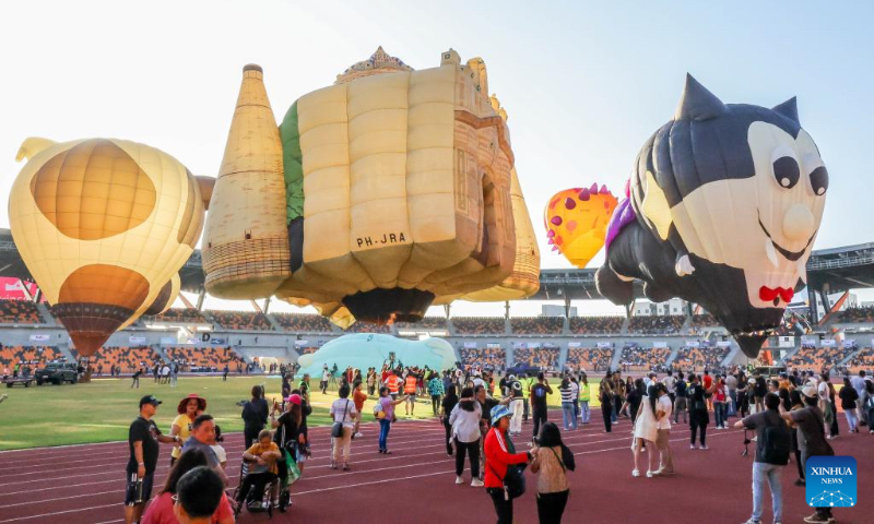 Hot air balloons rise during the 24th Philippine International Hot Air Balloon Fiesta in Tarlac Province, the Philippines, on Feb. 16, 2024. The 24th Philippine International Hot Air Balloon Fiesta will be held here from Feb. 16 to 18 to showcase hot air balloons and hold many aerial activities. (Xinhua/Rouelle Umali)