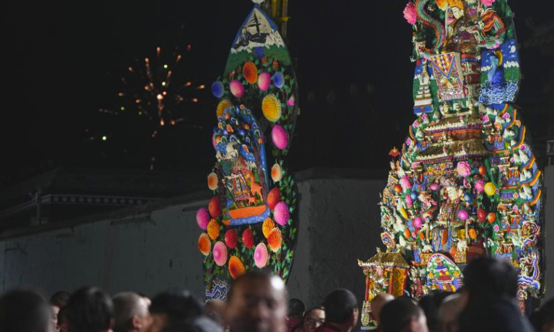 Butter sculptures made by Buddhists are displayed at Labrang Monastery in Xiahe County, northwest China's Gansu Province, Feb. 24, 2024. An annual butter sculpture show was held at Labrang Monastery, one of six prestigious temples of the Gelug Sect of Tibetan Buddhism, on Saturday, the Chinese Lantern Festival, to pray for good fortune and harvest. (Xinhua/Fang Xin)