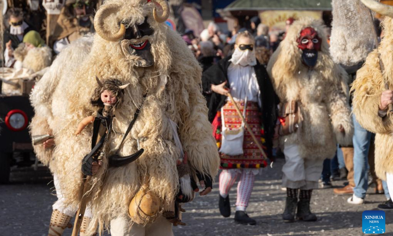 Busos, costumed people wearing wooden masks and woolly cloaks, take part in the Buso Carnival in Mohacs, Hungary, on Feb. 13, 2024. The Buso festivities at Mohacs in southern Hungary are a six-day carnival in February to mark the end of winter, named for the busos, wearing wooden masks and big woolly cloaks. The folk tradition was inscribed on UNESCO's Representative List of the Intangible Cultural Heritage of Humanity in 2009. (Photo: Xinhua)