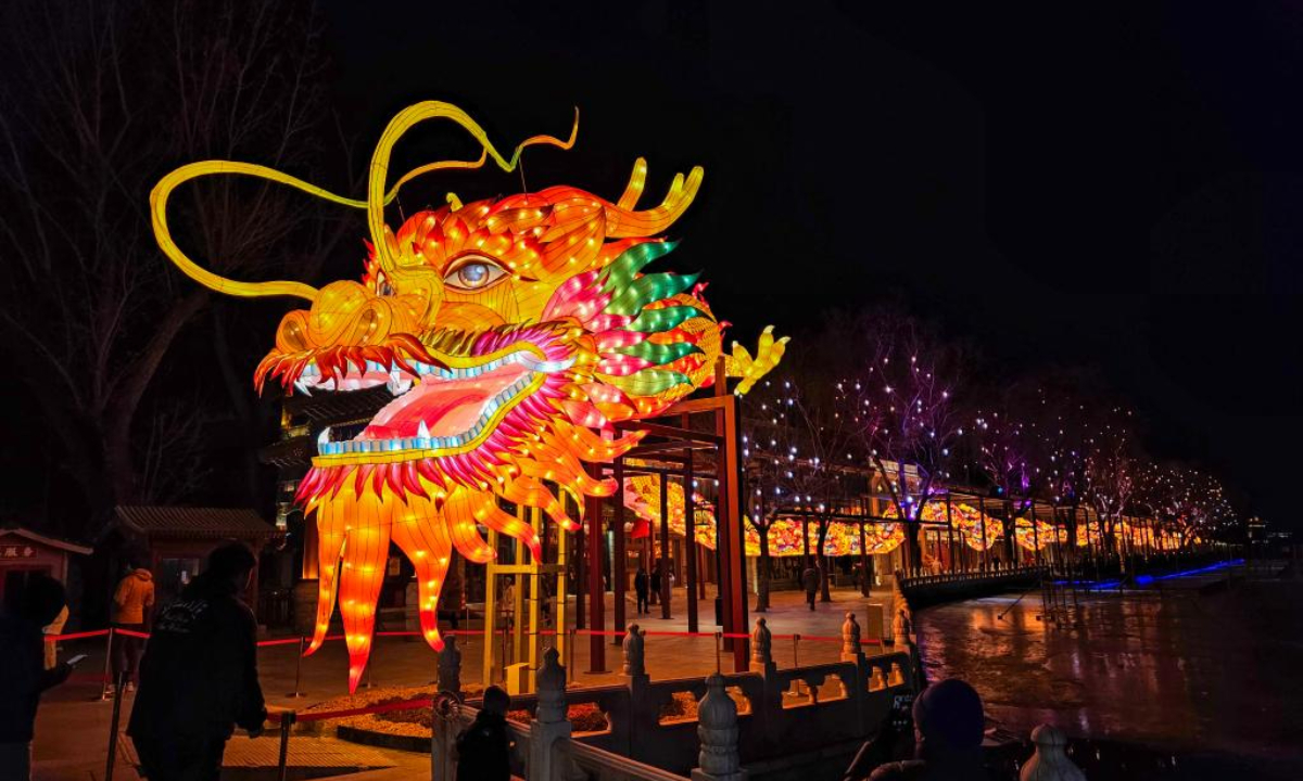 A dragon-shaped light installation is seen on Lunar New Year Eve in Shichahai area, Beijing, capital of China, Feb 9, 2024. Photo:Xinhua