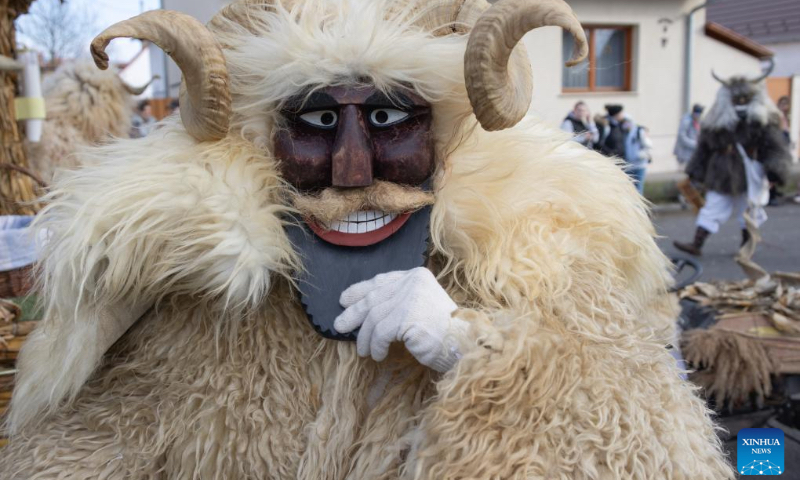 Busos, costumed people wearing wooden masks and woolly cloaks, take part in the Buso Carnival in Mohacs, Hungary, on Feb. 13, 2024. The Buso festivities at Mohacs in southern Hungary are a six-day carnival in February to mark the end of winter, named for the busos, wearing wooden masks and big woolly cloaks. The folk tradition was inscribed on UNESCO's Representative List of the Intangible Cultural Heritage of Humanity in 2009. (Photo: Xinhua)