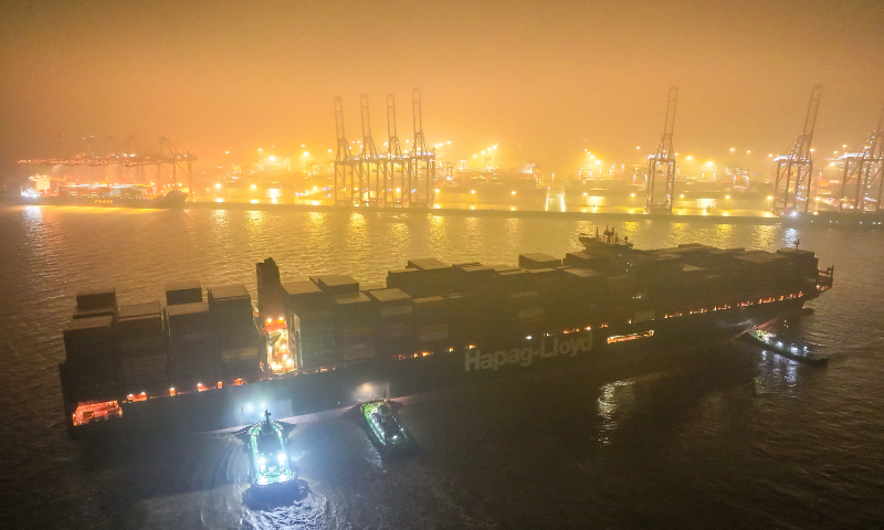 A container ship prepares to dock in the Dapukou wharf of the Ningbo Zhoushan Port in Ningbo, East China’s Zhejiang Province, in the wee hours of February 7, 2024. Nine ships are loading and unloading containers at the wharf. In 2023, Ningbo Zhoushan Port handled 1.324 billion tons of cargo, ranking first in the world for the 15th consecutive year. Photo: VCG