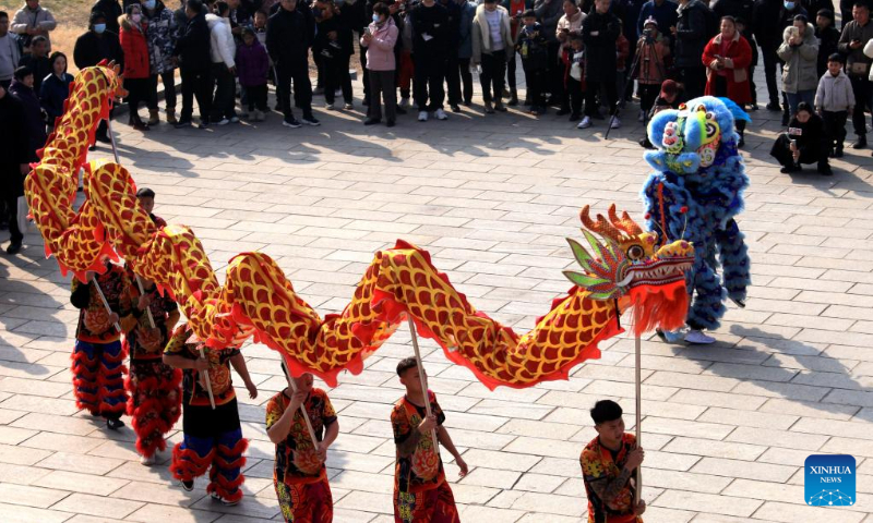 Folk artists perform dragon dance and lion dance in Pingyi County, east China's Shandong Province, Feb. 11, 2024. China on Saturday ringed in the Chinese Lunar New Year, or Spring Festival. Regarded as the most celebrated holiday among Chinese, it signifies a time of joyful family reunions and a slew of cultural events. (Photo by Wu Jiquan/Xinhua)