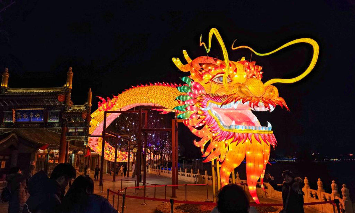 A dragon-shaped light installation is seen on Lunar New Year Eve in Shichahai area, Beijing, capital of China, Feb 9, 2024. Photo:Xinhua