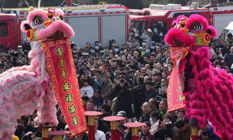 Folk artists perform lion dance during a temple fair held in Xunxian County of central China's Henan Province, Feb. 25, 2024. Local residents of Shehuo performing teams participated in a temple fair in Xunxian on Sunday, one day after the Chinese Lantern Festival. Shehuo is a traditional carnival-like folk celebration, featuring performances like dragon dance, lion dance, traditional Chinese opera, drum playing and other folk performances that may vary in different regions. (Photo by Zhang Tingyuan/Xinhua)