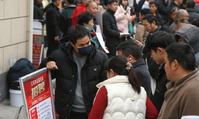 Recruiters and job seekers talk at a job fair in Yiwu, East China’s Zhejiang Province, on February 21, 2024. Enterprises and merchants in Yiwu have resumed work and production after the eight-day Spring Festival holidays, and the demand for workers has increased significantly. Photo: VCG