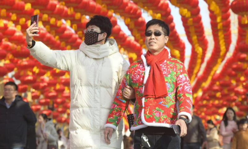 People visit the Longmen Grottoes scenic spot in Luoyang City, central China's Henan Province, Feb. 12, 2024. During the Spring Festival holiday, various cultural tourism events across central China's Henan Province have attracted lots of tourists. (Photo by Zhang Yixi/Xinhua)