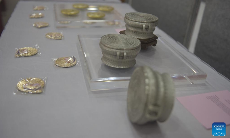 Exhibits are seen at a Chinese and Cambodian cultural exhibition in Phnom Penh, Cambodia, Jan. 21, 2024. A China-Cambodia Beauty of Intangible Heritage exhibition kicked off here in the Cambodian capital on Sunday, captivating hundreds of visitors. (Photo by Liao Hongqing/Xinhua)