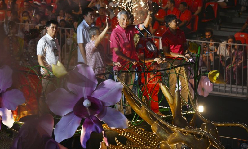 Singaporean Prime Minister Lee Hsien Loong (C) attends the Chingay Parade as part of the Lunar New Year celebrations in Singapore's F1 Pit Building on Feb. 23, 2024. (Photo by Then Chih Wey/Xinhua)