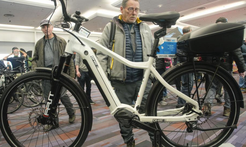 A man looks at an electric bicycle during the BC Bike Show at the Vancouver Convention Center in Vancouver, British Columbia, Canada, on March 2, 2024.

The two-day bicycle consumer show features the latest products and services from approximately 70 exhibitors and aims at promoting cycling culture and fostering eco-friendly living. (Photo by Liang Sen/Xinhua)