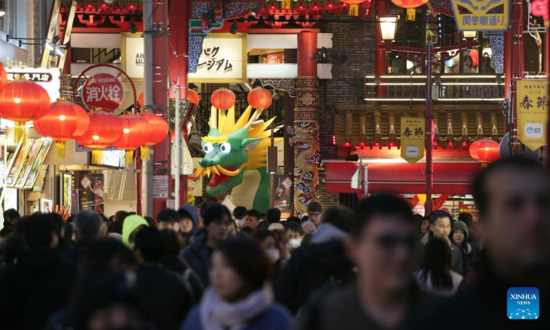 Tourists visit the Chinatown of Yokohama, Japan, Feb. 11, 2024. Tourists came to the Chinatown to enjoy festive atmosphere of the Spring Festival. (Xinhua/Yue Chenxing)