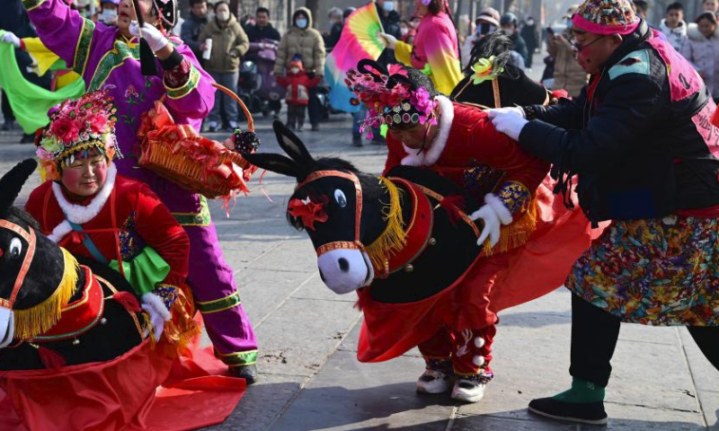 Villagers perform Yangge, a traditional folk dance, in Liaocheng, east China's Shandong Province, Feb. 11, 2024. China on Saturday ringed in the Chinese Lunar New Year, or Spring Festival. Regarded as the most celebrated holiday among Chinese, it signifies a time of joyful family reunions and a slew of cultural events. (Photo by Zhang Zhenxiang/Xinhua)