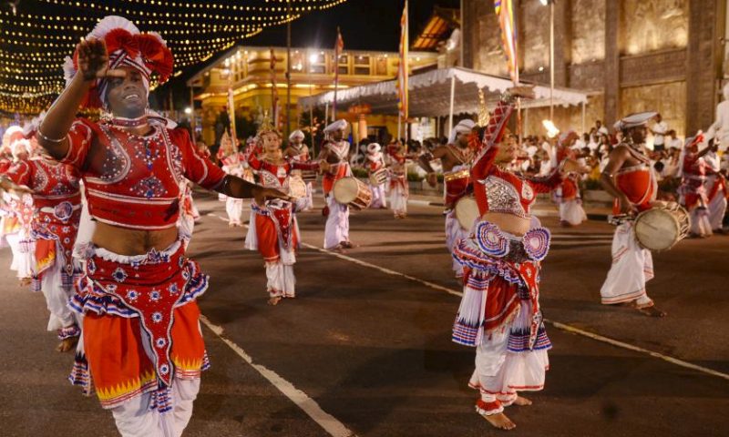 People perform traditional dances during the annual Navam Perahera festival in Colombo, Sri Lanka, on Feb. 23, 2024. (Photo by Gayan Sameera/Xinhua)