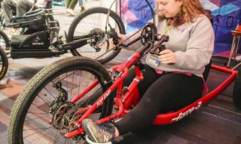 A woman tries out a tricycle during the BC Bike Show at the Vancouver Convention Center in Vancouver, British Columbia, Canada, on March 2, 2024.

The two-day bicycle consumer show features the latest products and services from approximately 70 exhibitors and aims at promoting cycling culture and fostering eco-friendly living. (Photo by Liang Sen/Xinhua)