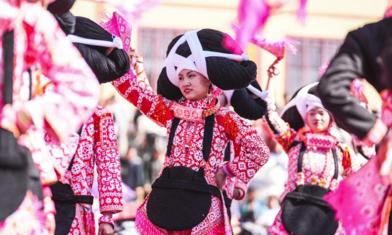 People of Miao ethnic group perform a dance to celebrate Tiaohua festival in Gaoxing Village of Liuzhi Special District, Liupanshui, southwest China's Guizhou Province, Feb. 19, 2024. People of Miao ethnic group celebrated the Tiaohua festival here on Monday to pray for the harvest and well-being in the new year. (Xinhua/Tao Liang)