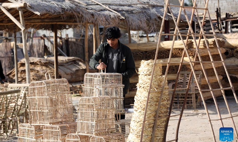 This photo taken on Jan. 21, 2024 shows furniture made from date palm leaves in Baghdad, Iraq. As an important part of the lives of Iraqis, date palms are used to craft furniture, including chairs, tables, beds and bird cages in Iraq. (Xinhua/Khalil Dawood)