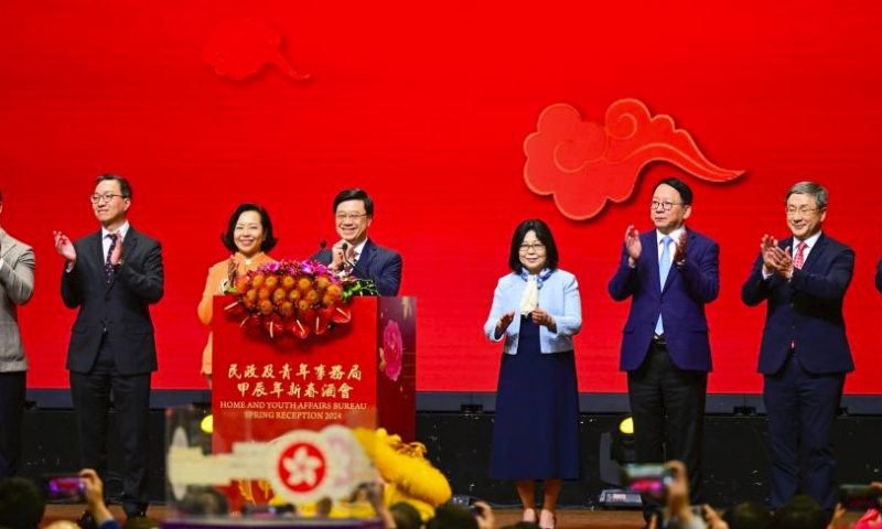 Chief Executive of the Hong Kong Special Administrative Region John Lee (4th,L) addresses the Home and Youth Affairs Bureau Spring Reception 2024 in Hong Kong, south China, Feb. 16, 2024. (Xinhua/Zhu Wei)