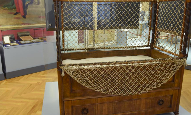 This photo taken on March 1, 2024 shows a baby cot of Austrian royal family displayed at the Vienna Furniture Museum in Vienna, Austria. With 165,000 exhibits, the Vienna Furniture Museum is one of the world's largest furniture museums today, presenting the culture of furniture from over three centuries. (Xinhua/He Canling)