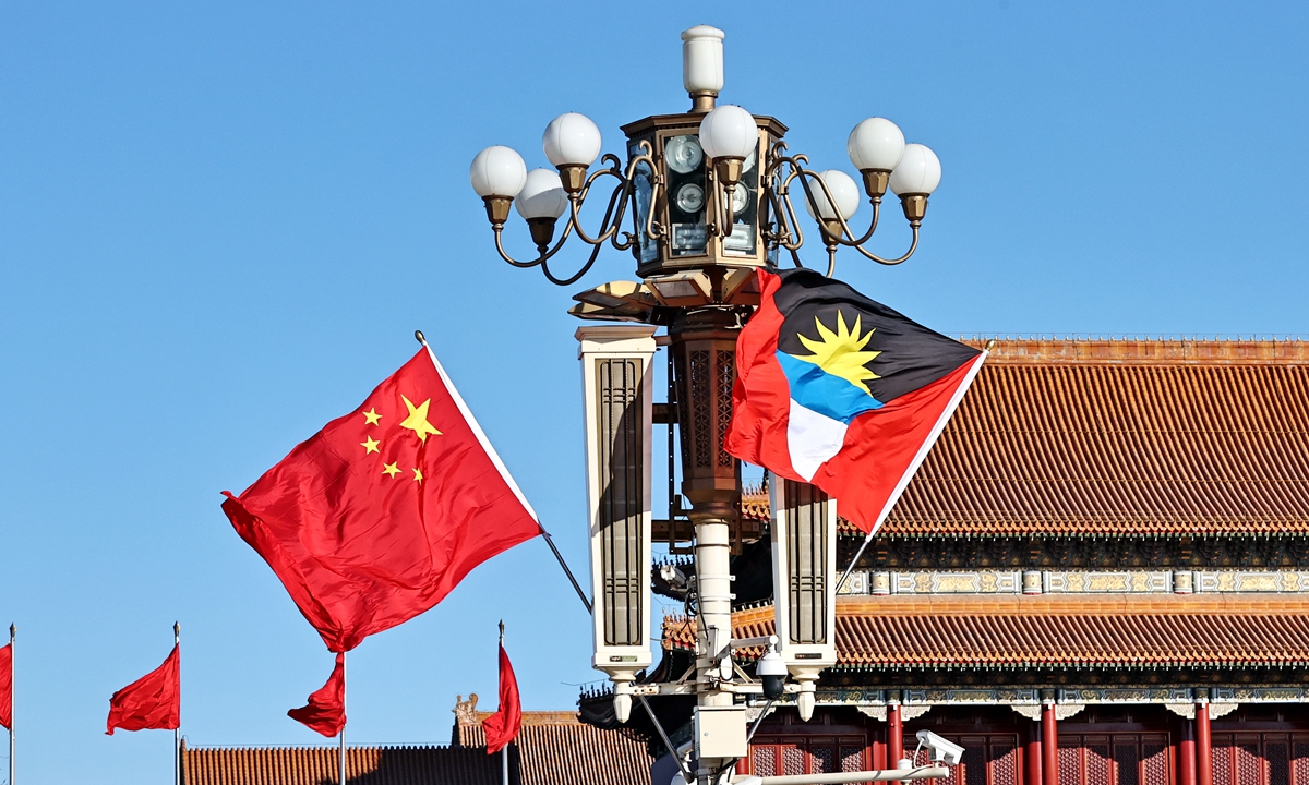 National flags of China and Antigua and Barbuda Photo:VCG