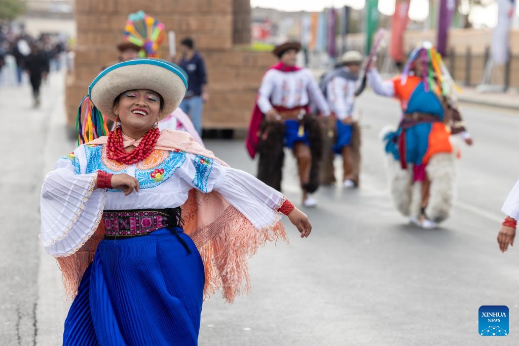 People in costumes take part in the float carnival on the first day of the 3rd Qemam International Festival for Mountain Performance Arts in Asir region, southwest Saudi Arabia, Jan. 20, 2024. The third edition of the festival is held from Jan. 20 to 27.(Photo: Xinhua)