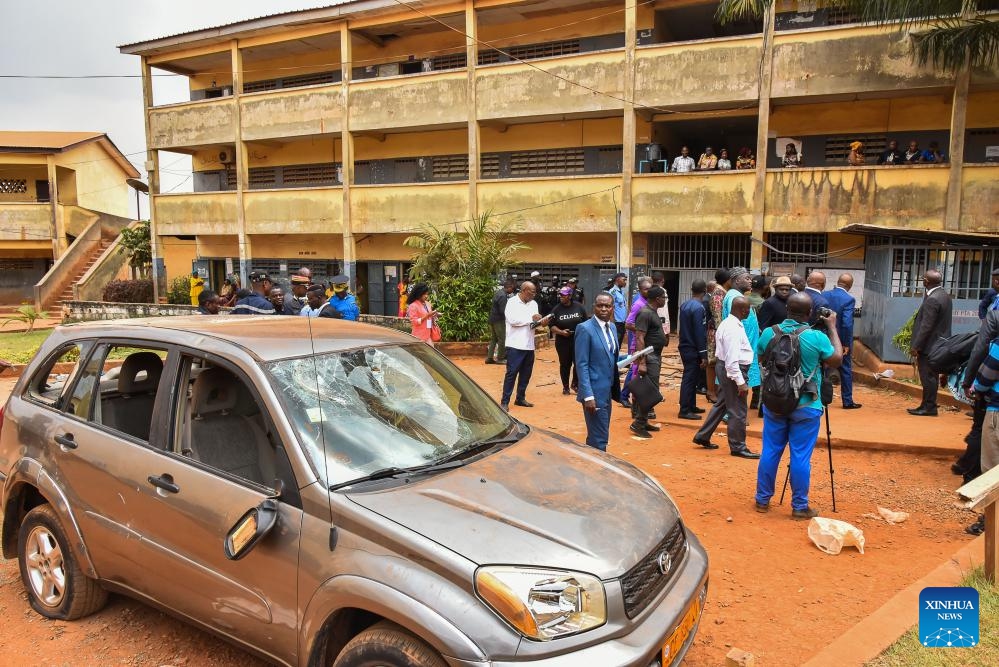 A man looks at a vehicle damaged in a stampede at the Etoug-Ebe Bilingual High School in Yaounde, Cameroon, on Jan. 22, 2024. About 106 students were injured on Monday following a stampede at the government-run secondary school in Yaounde, according to Minister of Public Health Manaouda Malachie.(Photo: Xinhua)