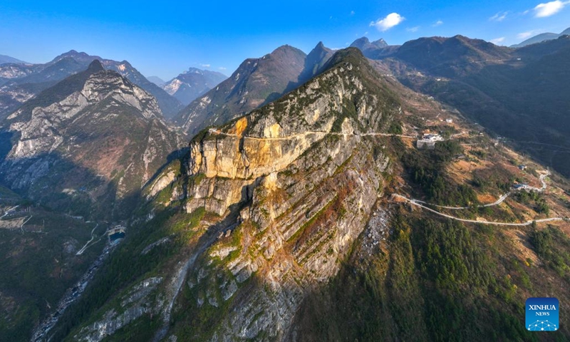 An aerial drone photo taken on Jan. 11, 2024 shows a view of Lanying Cliff Road in Wuxi County, southwest China's Chongqing. Located in Lanying Grand Canyon in Wuxi County, the Lanying Cliff Road is an awesome path carved out of the mountains. The road, built for over four years by the locals, is the only transportation route connecting Lanying Village to the outside world.(Photo: Xinhua)