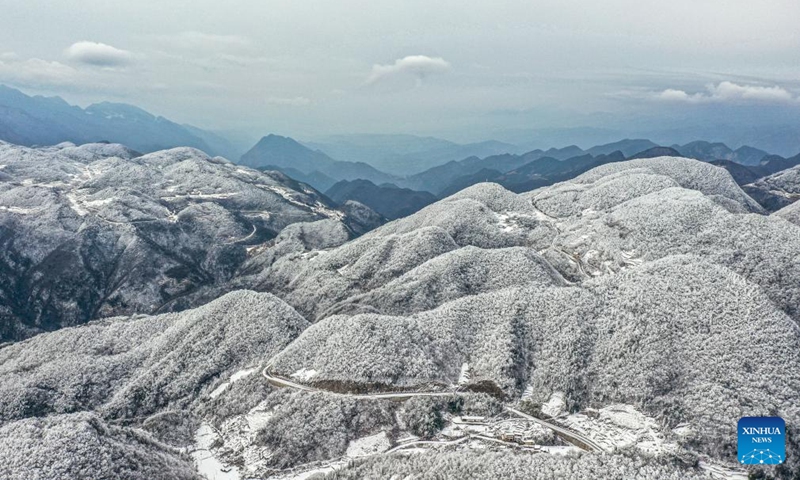 An aerial drone photo taken on Jan. 24, 2024 shows snow scenery at a section of the Wushan Mountain in Zhuxian Town of Wushan County, southwest China's Chongqing.(Photo: Xinhua)