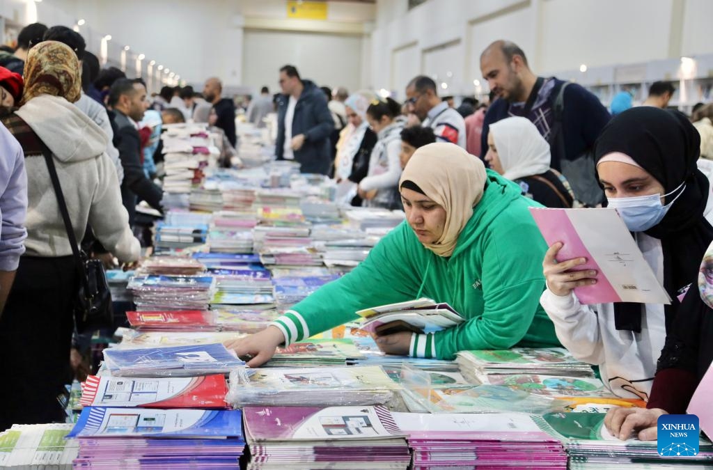 People visit the 55th Cairo International Book Fair (CIBF) in Cairo, Egypt, on Jan. 25, 2024. The 55th Cairo International Book Fair (CIBF), held from Jan. 24 to Feb. 6 under the slogan of We Create Knowledge, We Preserve the Word, attracts 1,200 publishers and 5,250 exhibitors from 70 countries and regions.(Photo: Xinhua)