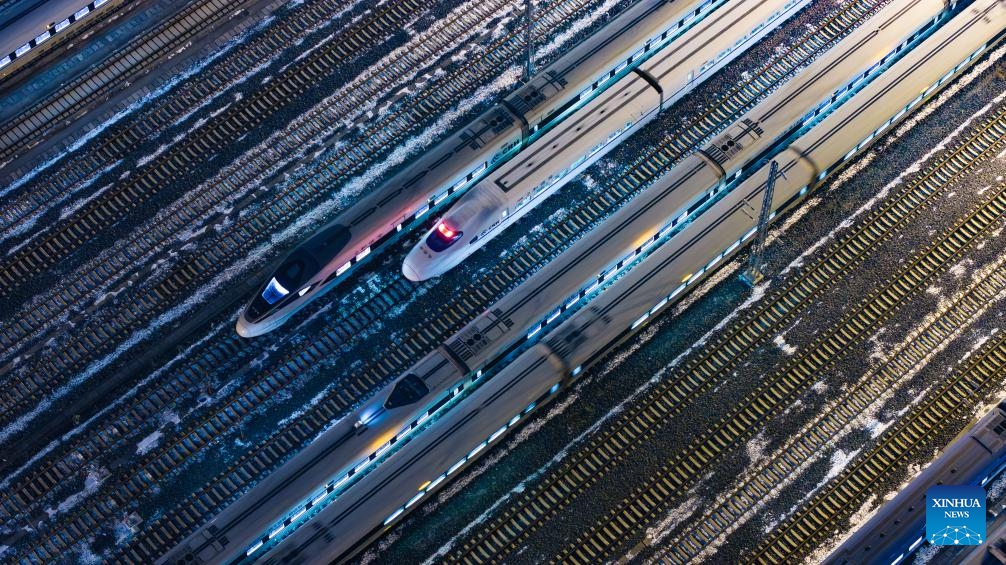 An aerial drone photo taken on Jan. 25, 2024 shows bullet trains at Guiyang North bullet train maintenance station in Guiyang, southwest China's Guizhou Province. The Spring Festival, China's biggest traditional festival, will fall on Feb. 10, while the Spring Festival travel rush, usually a period of high transportation demand as people return home for family reunions, will run from Jan. 26 to March 5.(Photo: Xinhua)